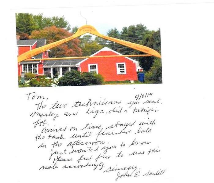 red house and tan hanger with thank you note written out