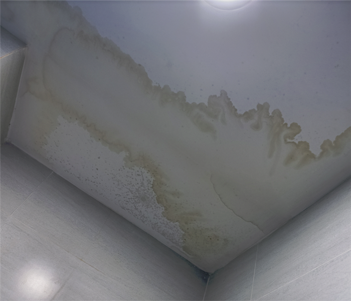 a water damaged ceiling with watermarks on it