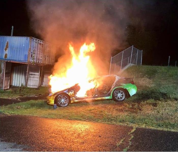 SERVPRO car on fire during a burn demonstration